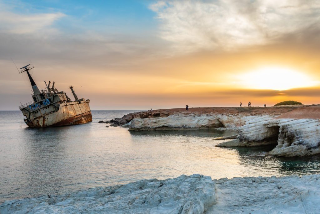 https://ekloges.disy.cy/wp-content/uploads/2025/09/abandoned-rusty-ship-stranded-ashore-sunset-rays-peyia-village-paphos-1024x683-1.jpg